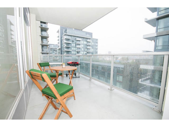 Furnished balcony with modern furniture and city view. - 802 - 1708 Columbia St, Vancouver West Side