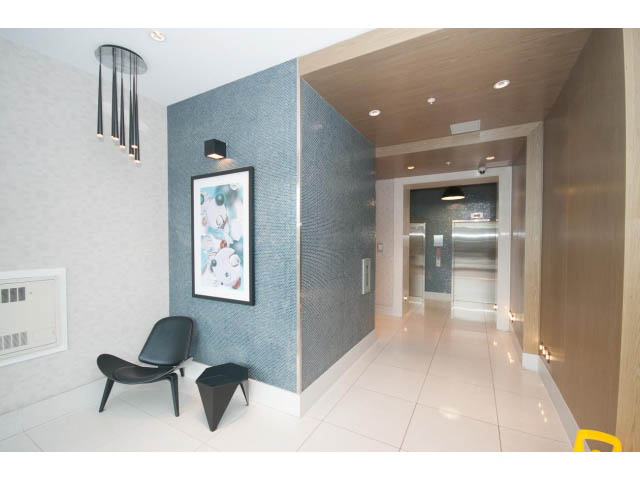 Bright and modern entryway with sleek lighting and blue mosaic accent wall. - 802 - 1708 Columbia St, Vancouver West Side