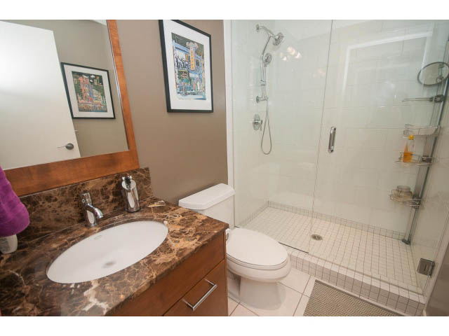 Bathroom with marble countertop and modern shower. - 2401 - 1005 Beach Avenue, Vancouver Downtown