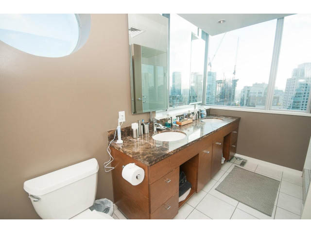 Bright bathroom with marble countertops, city view, and modern design. - 2401 - 1005 Beach Avenue, Vancouver Downtown