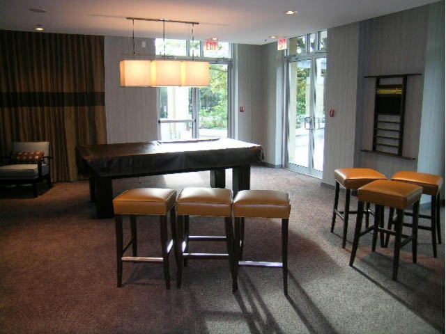 Furnished dining area with modern lighting and bar stools. - 2401 - 1005 Beach Avenue, Vancouver Downtown