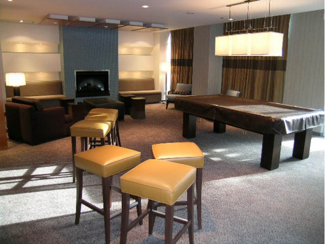 Furnished living room with modern furniture, large windows, and a cozy fireplace. - 2401 - 1005 Beach Avenue, Vancouver Downtown
