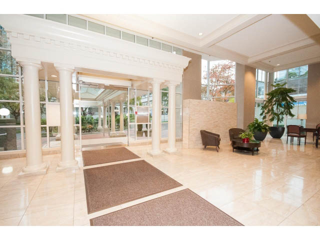Furnished living room with marble floors, large windows, and plush seating. - 303 - 717 Jervis St, Vancouver Downtown