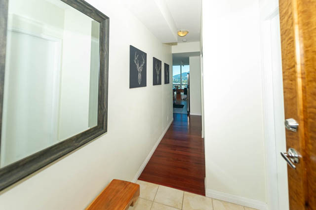 Bright hallway leading to living area with hardwood floors and city view. - 1905 - 138 East Esplanade Ave, North Vancouver
