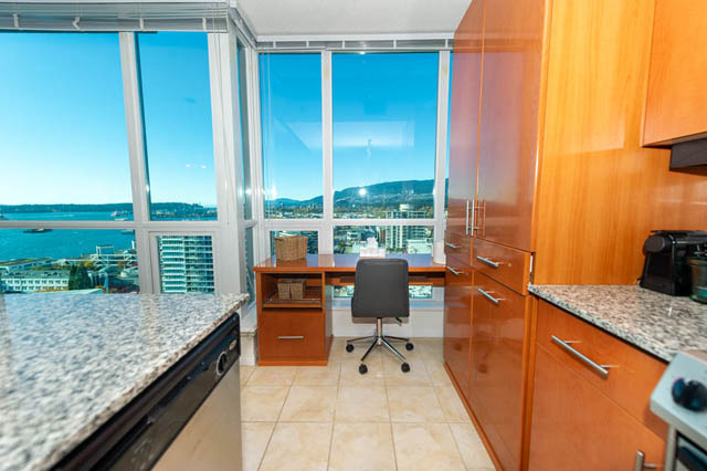 Bright kitchen with granite countertops and city view. - 1905 - 138 East Esplanade Ave, North Vancouver