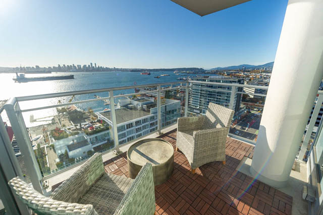 Furnished balcony with city view and harbor, modern furnishings. - 1905 - 138 East Esplanade Ave, North Vancouver