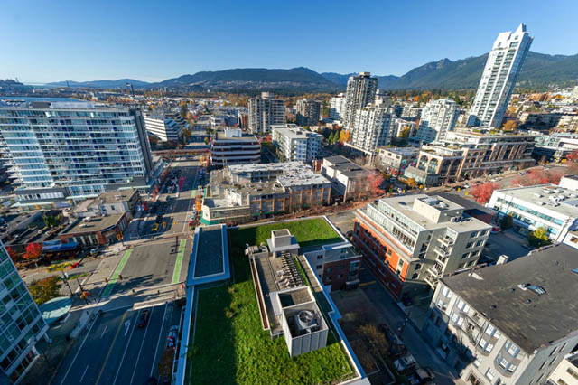 Bright living room with city view and modern furnishings. - 1905 - 138 East Esplanade Ave, North Vancouver