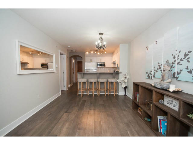 Furnished living room with hardwood floors and a cozy corner bench. - 106 - 1868 W. 5th Avenue, Vancouver West Side