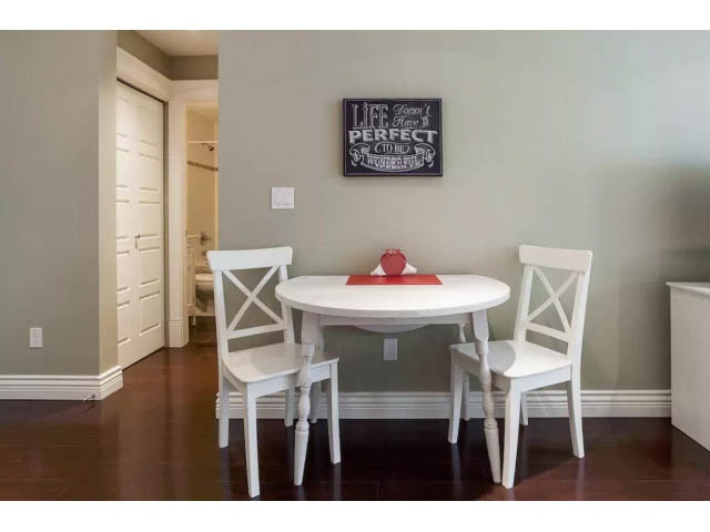 Furnished dining area with white table, chairs, and red placemats. - 188 West 23rd Ave, Vancouver West Side