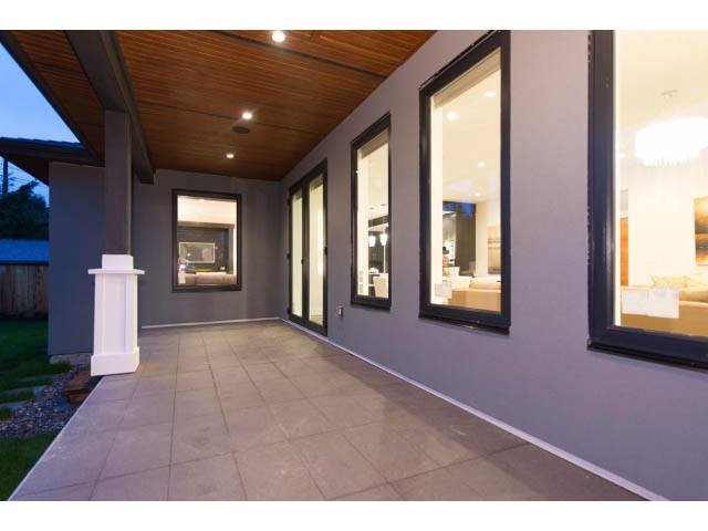 Spacious patio with large windows and tiled flooring. - 3192 Beverley Cres, North Vancouver