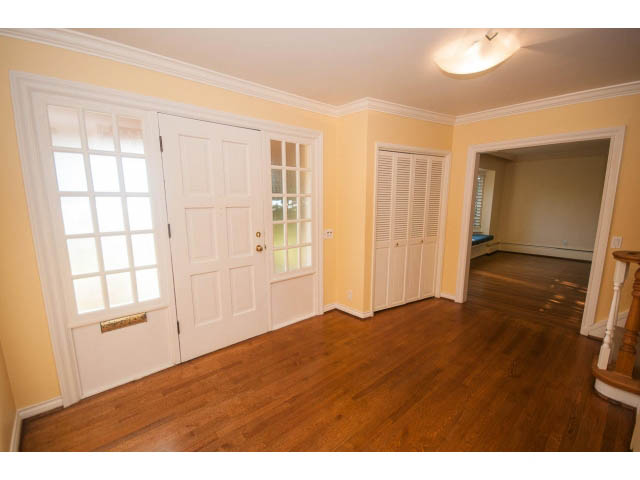 Bright dining area with hardwood floors and French doors leading outside. - 1145 Sutton Place, West Vancouver