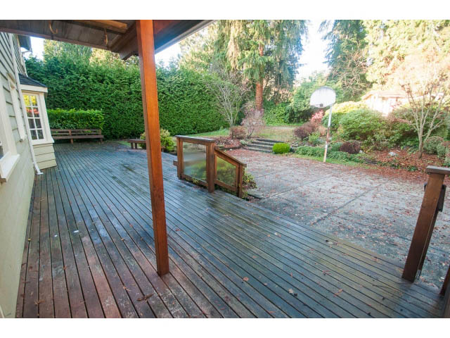 Bright deck with wooden flooring and garden view. - 1145 Sutton Place, West Vancouver