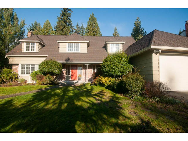 Furnished 5-bedroom house with a well-maintained lawn and a brick facade. - 1145 Sutton Place, West Vancouver