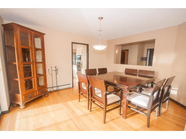 Furnished dining room with wooden furniture and hardwood floors. - 4251A Rockbank, West Vancouver