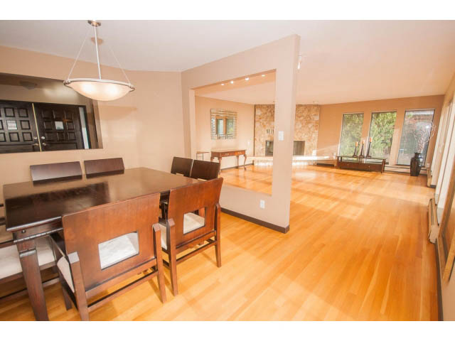 Furnished dining area with hardwood floors and a wooden table. - 4251A Rockbank, West Vancouver