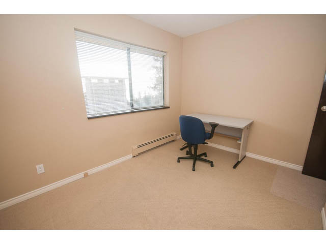 Spacious den with beige carpet, desk, and window with blinds. - 4251A Rockbank, West Vancouver