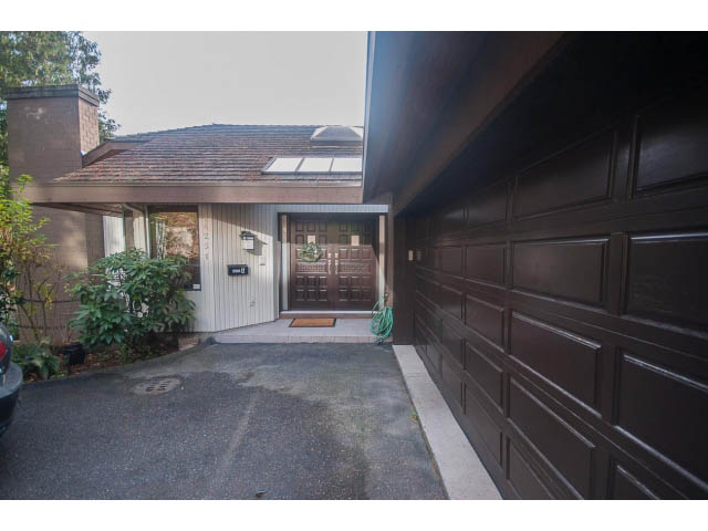 Furnished 4-bedroom + den house with dark wood paneling and a cozy entrance. - 4251A Rockbank, West Vancouver