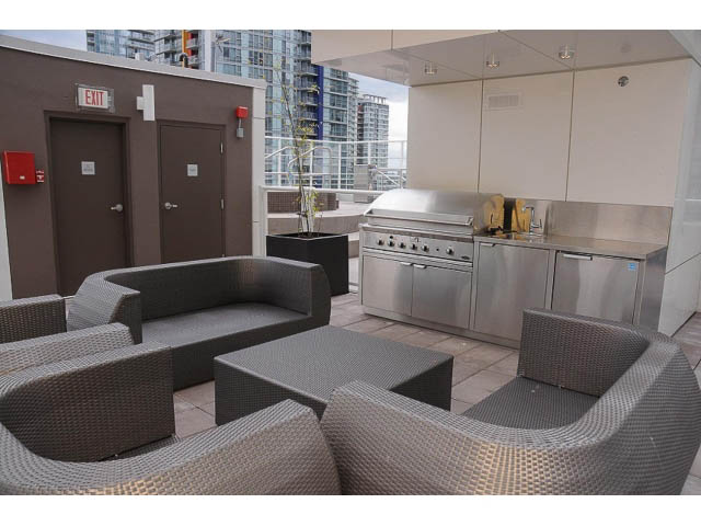 Furnished patio with modern grill and comfortable seating, city view. - 3105 - 602 Citadel Parade, Vancouver Downtown