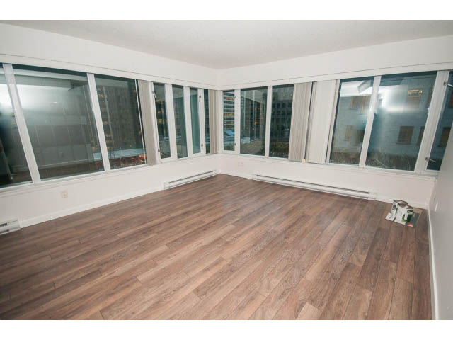 Bright living room with hardwood floors and large windows offering city views. - 513 - 610 Granville Street, Vancouver Downtown