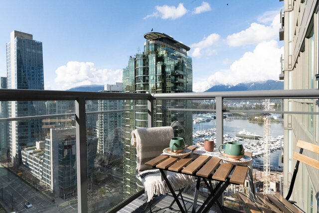 Furnished balcony with city view, modern furniture, and stunning waterfront scenery. - 2303 - 1328 West Pender Street, Vancouver Downtown