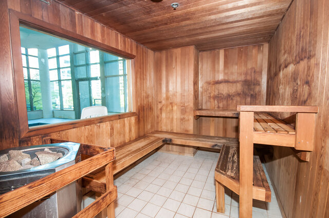 Spacious sauna with wooden benches and large window offering city views. - 2303 - 1328 West Pender Street, Vancouver Downtown