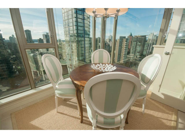 Bright dining area with city view, elegant furniture, and natural light. - 1402 - 1680 Bayshore Drive, Vancouver Downtown