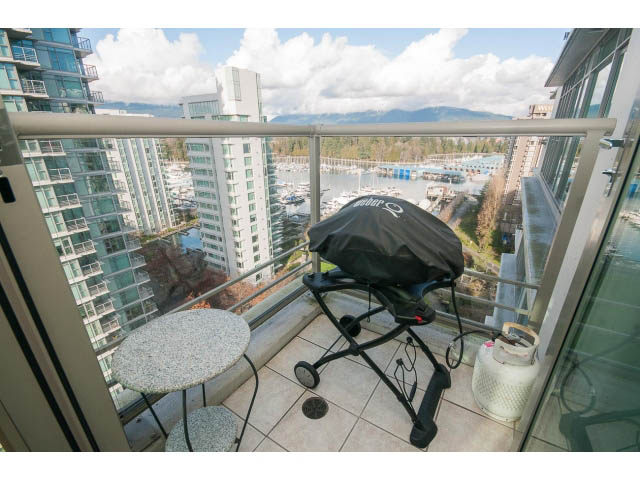 Furnished balcony with glass railings, city view, and outdoor furniture. - 1402 - 1680 Bayshore Drive, Vancouver Downtown