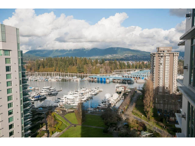 Bright living room with a stunning city view and marina, featuring modern furnishings and a balcony. - 1402 - 1680 Bayshore Drive, Vancouver Downtown