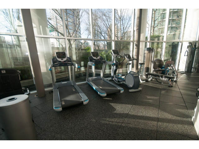 Bright gym with large windows, city view, and modern equipment. - 1402 - 1680 Bayshore Drive, Vancouver Downtown