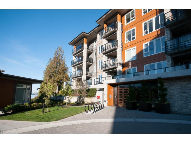 Furnished 2-bedroom + den condo with modern balcony and stone accents. - 203 - 3825 Cate's Landing, North Vancouver