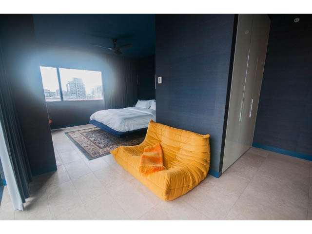 Furnished den with orange bean bags and city view. - 2301 - 838 W Hastings, Vancouver Downtown