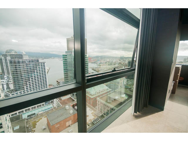 Bright living room with city view and large windows. - 2301 - 838 W Hastings, Vancouver Downtown