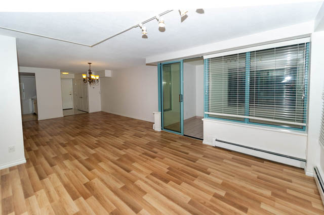 Bright living room with hardwood floors and large windows. - 204 - 283 Davie Street, Vancouver Downtown