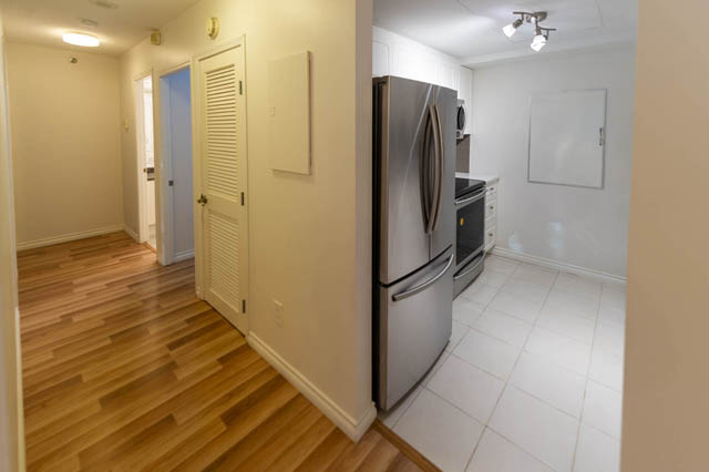 Bright kitchen with stainless steel appliances and hardwood floors. - 204 - 283 Davie Street, Vancouver Downtown