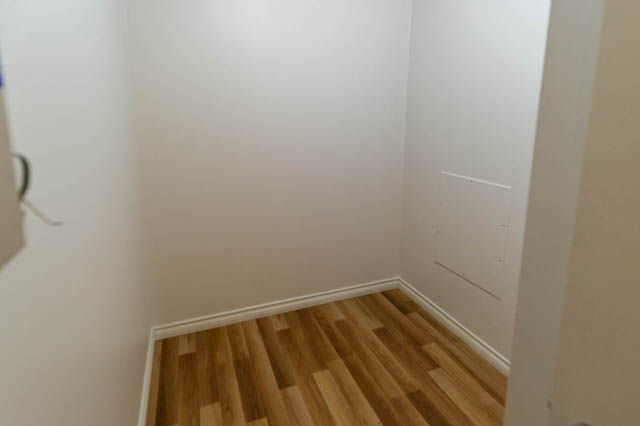 Den with hardwood floors and white walls. - 204 - 283 Davie Street, Vancouver Downtown