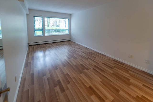 Bright living room with hardwood floors and city view. - 204 - 283 Davie Street, Vancouver Downtown