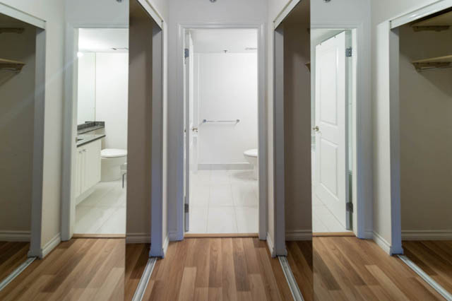 Bright hallway with hardwood floors and a modern bathroom with a vanity and shower. - 204 - 283 Davie Street, Vancouver Downtown