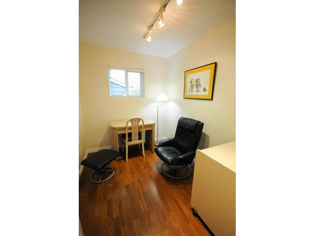 Bright living room with hardwood floors and a framed picture on the wall. - 1397 Tatlow Avenue, North Vancouver