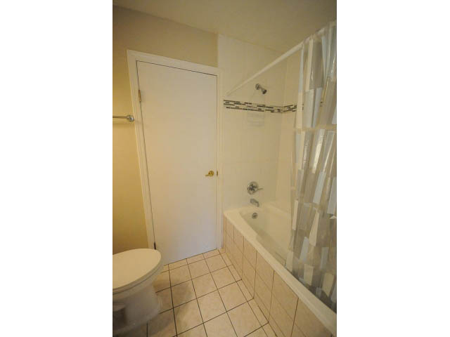 Bathroom with white fixtures and tiled floor. - 1397 Tatlow Avenue, North Vancouver