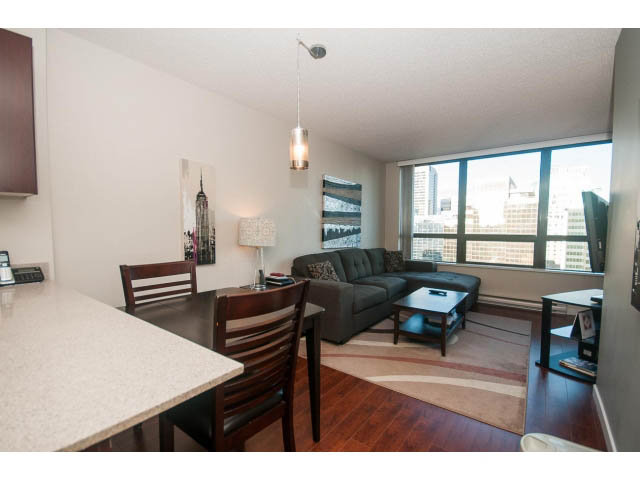 Furnished kitchen with granite countertops, hardwood floors, and city view. - 2013 - 938 Smithe Street, Vancouver Downtown