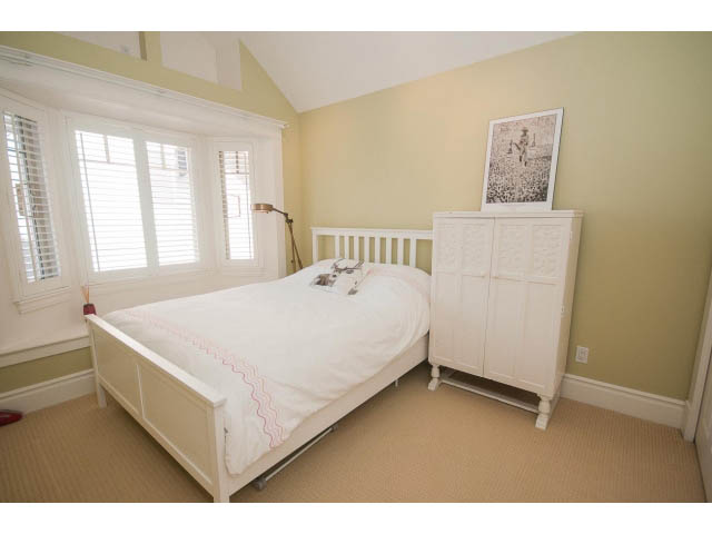 Bright bedroom with white furniture and large windows. - 398 W 13th Ave, Vancouver West Side