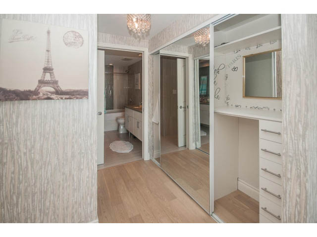 Bright and airy bedroom with hardwood floors, large closet, and city view. - 1008-199 Victory Ship Way, North Vancouver