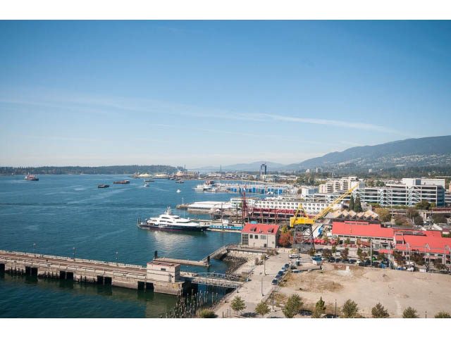 Bright kitchen with city view and waterfront access. - 1008-199 Victory Ship Way, North Vancouver