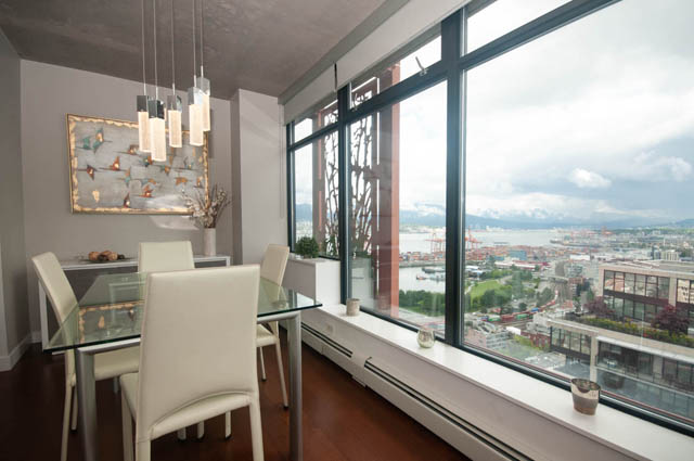 Furnished dining area with city view and hardwood floors. - 3806 - 128 Cordova St W, Vancouver Downtown