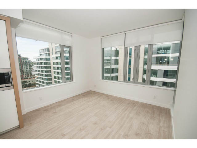 Bright living room with hardwood floors and city view. - 1108 - 1661 Quebec St, Vancouver West Side