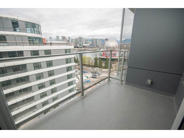 Furnished balcony with city view and modern architecture. - 1108 - 1661 Quebec St, Vancouver West Side