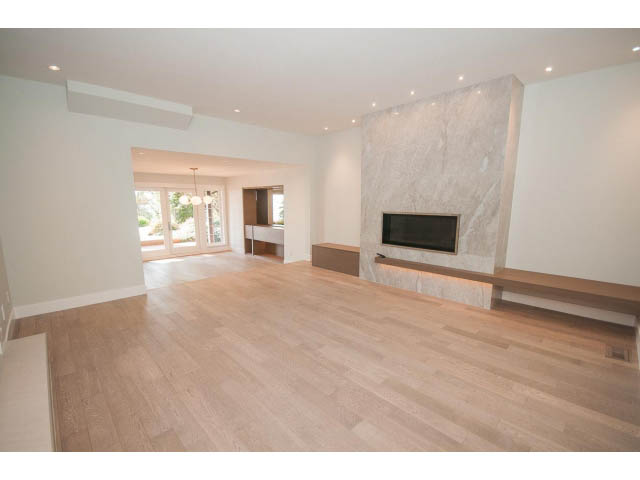 Spacious living room with hardwood floors and marble fireplace. - 6018 Gleneagles Place, West Vancouver