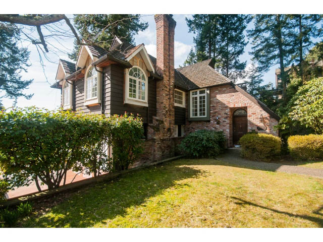 Furnished 5-bedroom house with brick accents and large windows. - 6018 Gleneagles Place, West Vancouver