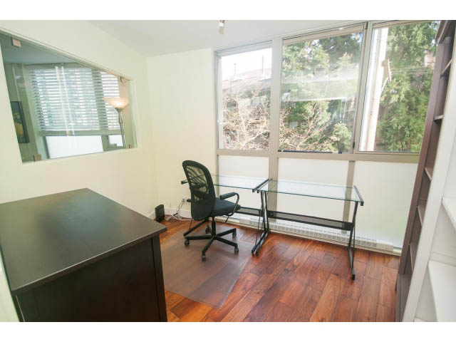 Furnished 1-bedroom + den with hardwood floors, glass desk, and city view. - 202 - 1277 Nelson St, Vancouver Downtown