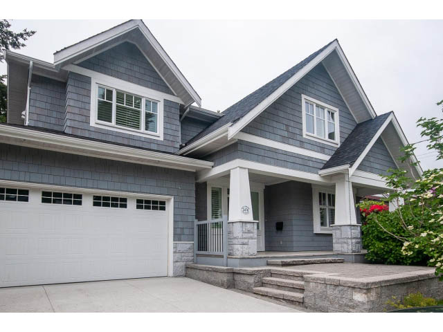 Bright 6-bedroom + den house with gray siding, white trim, and a welcoming front porch. - 3476 Wellington Crescent, North Vancouver